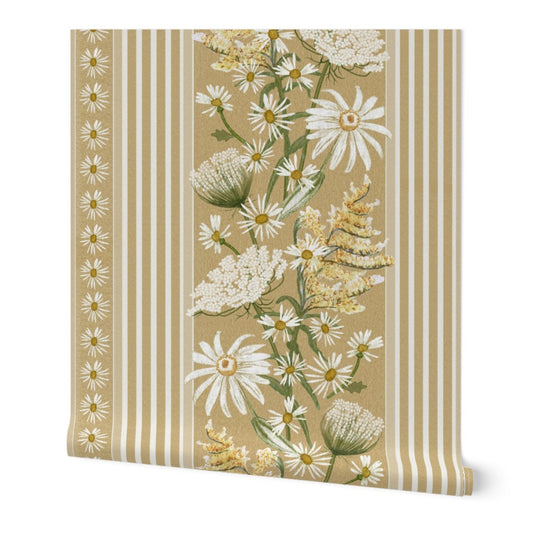 A roll of hand painted wallpaper featuring a vintage botanical pattern with white daisies, queen Anne's lace, and other wildflowers on a warm beige background with vertical stripes.